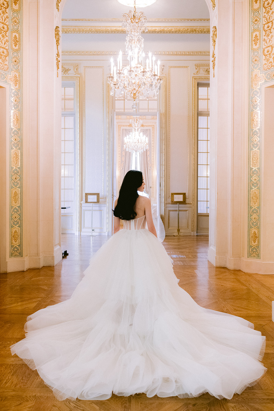 The bride poses in front of the lens for the photographer